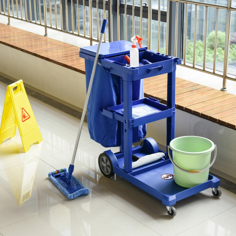 Janitorial cart and cleaning supplies in a clean office hallway in North York