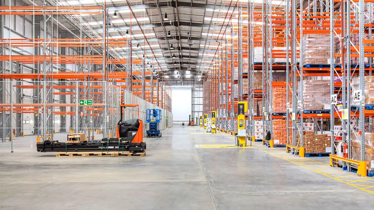 Warehouse cleaning Aurora industrial facility with maintained floors, storage areas, and operational workspace