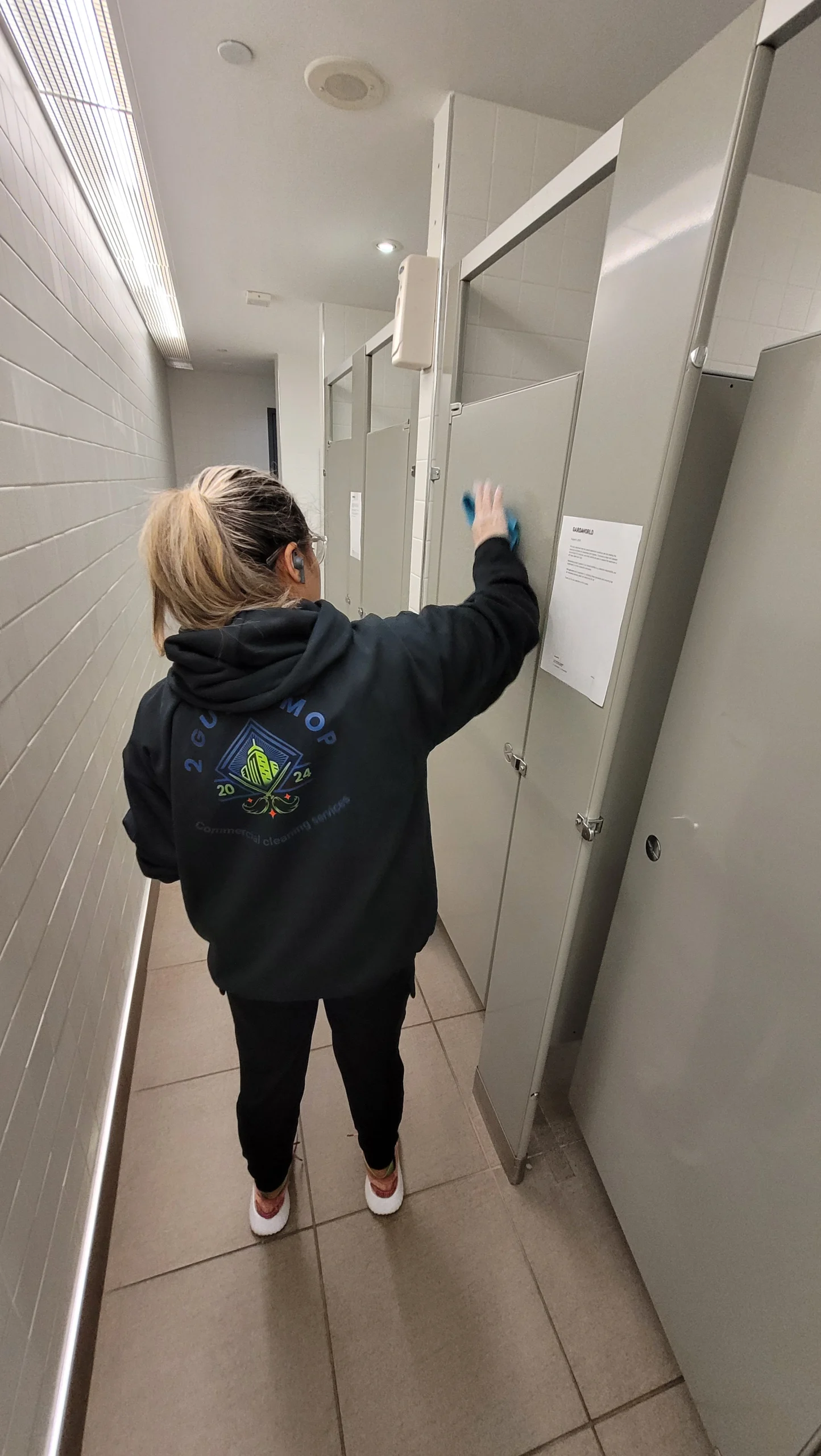 Cleaning a workplace washroom to meet washroom cleaning standards in Aurora